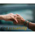 Hands holding together with “Aging Gracefully,” symbolizing wellness and youthful living.